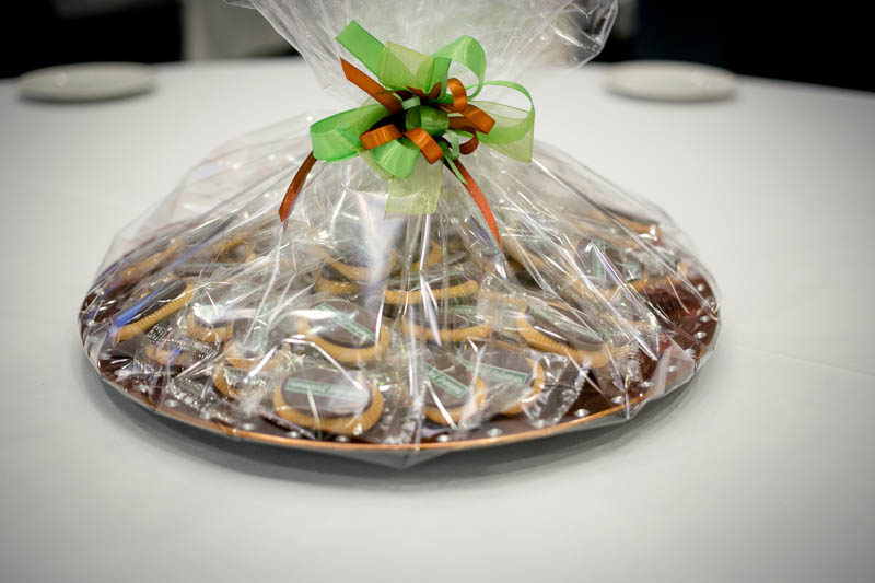 Corporate Gift Baskets - 350g Plastic plate filled with 50 pcs of 5 g biscuits topped with branded chocolate bar
